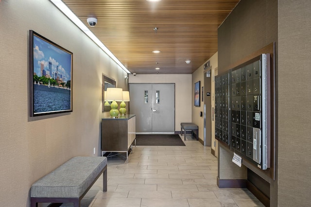 interior space featuring recessed lighting, wood ceiling, and mail area