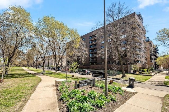 view of property's community with a yard