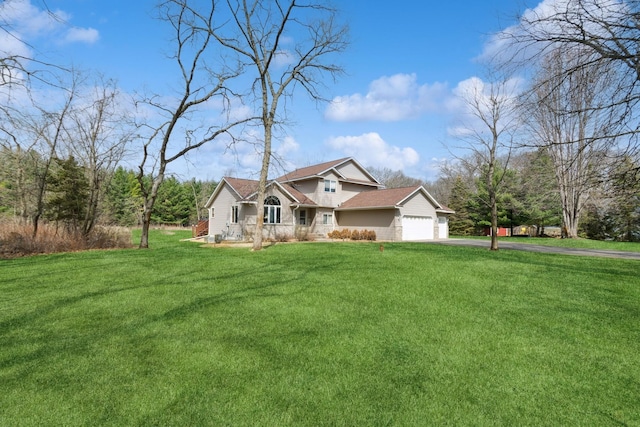 14580 30th St, Clear Lake, MN 55319 - view of front of house featuring asphalt driveway, an attached garage, and a front yard