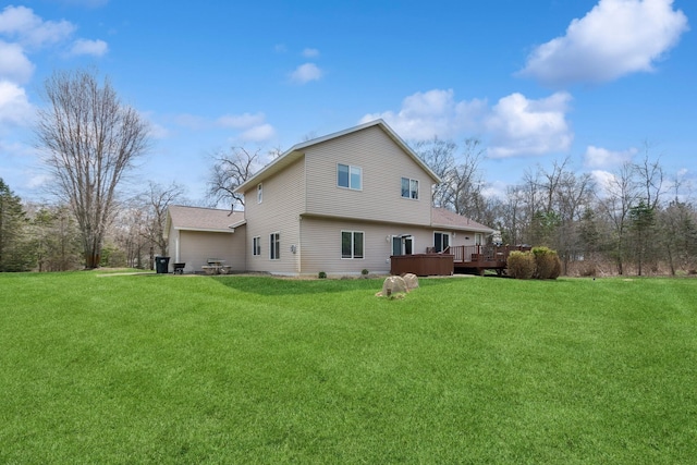 14580 30th St, Clear Lake, MN 55319 - rear view of house featuring a deck, a lawn, and roof with shingles