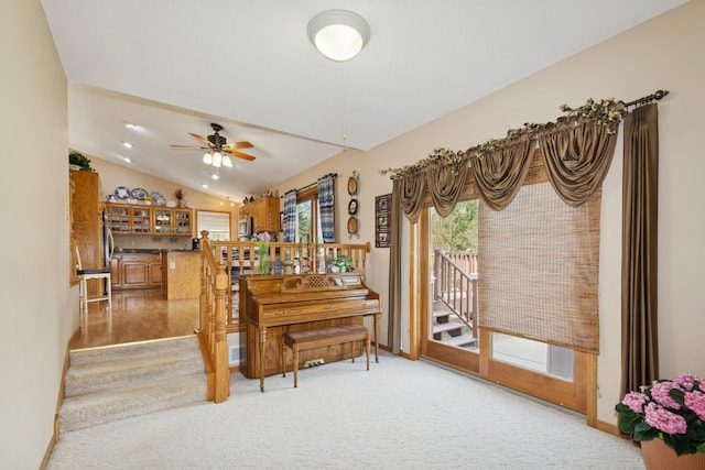 14580 30th St, Clear Lake, MN 55319 - dining space featuring lofted ceiling, ceiling fan, light carpet, and stairway