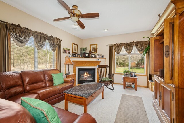 14580 30th St, Clear Lake, MN 55319 - living area featuring light carpet, a ceiling fan, and a glass covered fireplace
