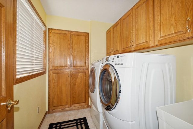 14580 30th St, Clear Lake, MN 55319 - washroom with cabinet space, washer and dryer, and light tile patterned flooring