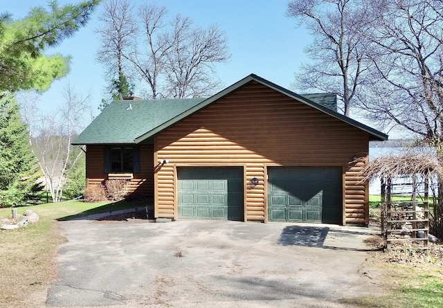 garage with asphalt driveway