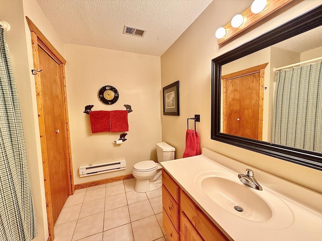 bathroom with a baseboard heating unit, tile patterned flooring, toilet, vanity, and a textured ceiling