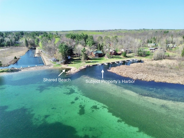 aerial view of a large body of water and a heavily wooded area