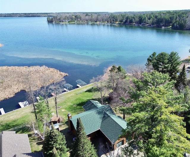 bird's eye view of a nearby body of water and a heavily wooded area