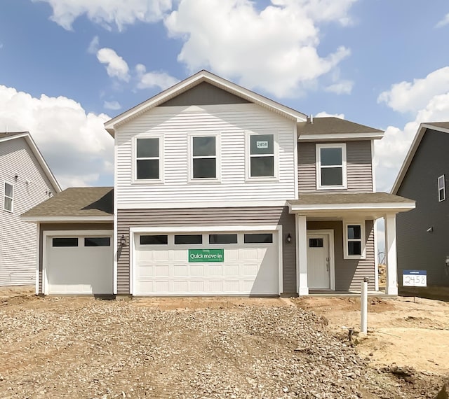 2458 Jandell Ave NE, Saint Michael, MN 55376 - traditional-style home featuring a garage and dirt driveway