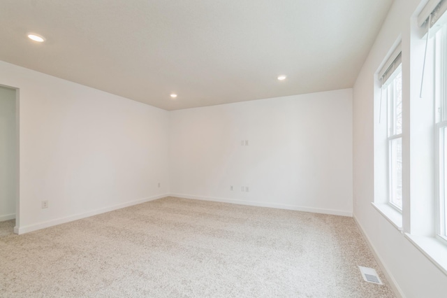 2458 Jandell Ave NE, Saint Michael, MN 55376 - carpeted empty room with plenty of natural light and recessed lighting