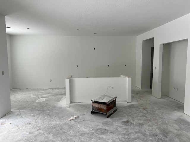spare room with a textured ceiling