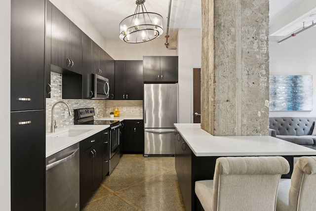 350 Saint Peter St Unit 704, Saint Paul, MN 55102 - kitchen featuring stainless steel appliances, a sink, light countertops, and a kitchen bar