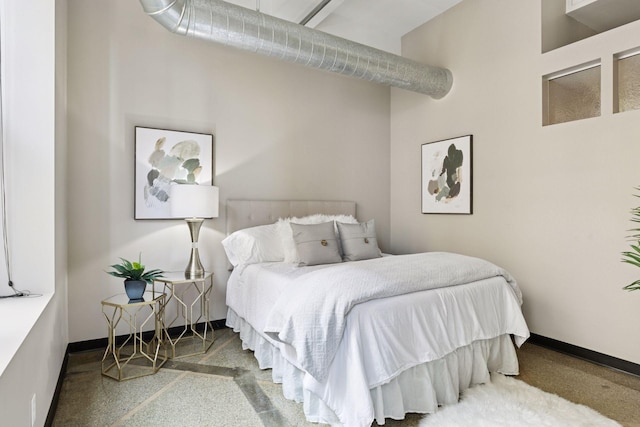 350 Saint Peter St Unit 704, Saint Paul, MN 55102 - bedroom with a towering ceiling and baseboards