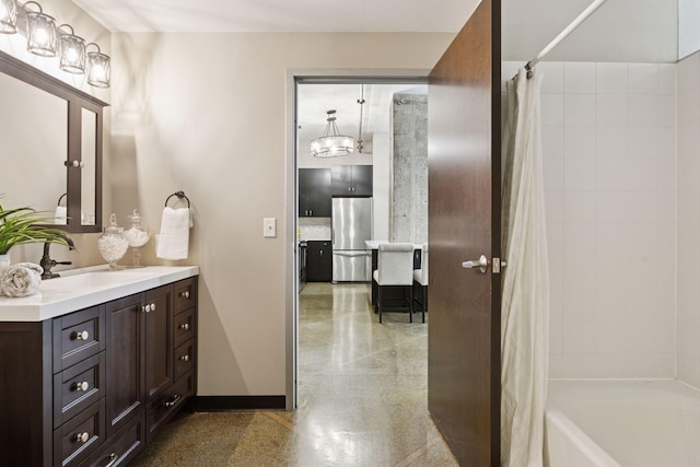 350 Saint Peter St Unit 704, Saint Paul, MN 55102 - full bath with vanity, baseboards, shower / tub combo, and a chandelier