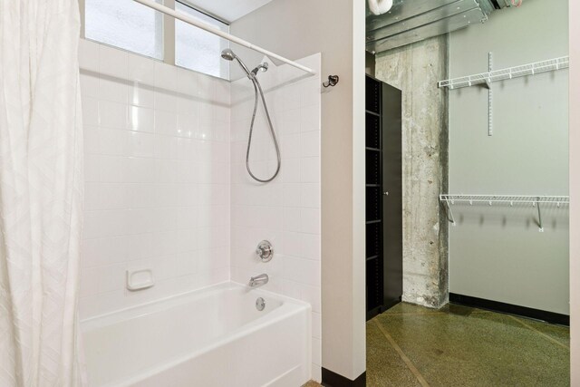 350 Saint Peter St Unit 704, Saint Paul, MN 55102 - full bath with shower / bathtub combination with curtain, a walk in closet, speckled floor, and baseboards