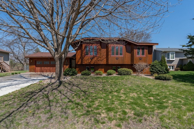 2324 Fair St, Mankato, MN 56001 - view of front of home with a garage, driveway, and a front yard