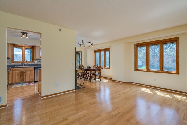 2324 Fair St, Mankato, MN 56001 - interior space with light wood-style floors, baseboards, visible vents, and a notable chandelier