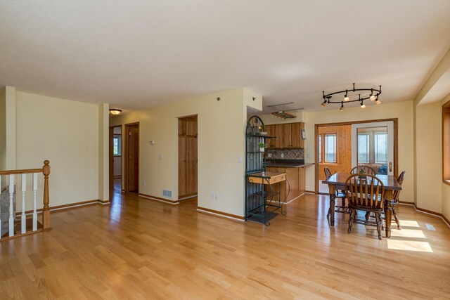 2324 Fair St, Mankato, MN 56001 - dining area featuring visible vents, light wood finished floors, and baseboards