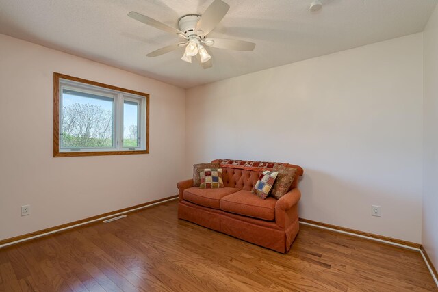 2324 Fair St, Mankato, MN 56001 - sitting room with baseboards, ceiling fan, and wood finished floors