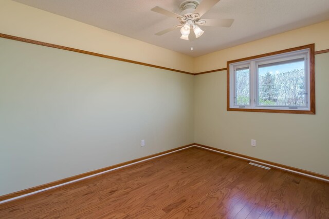 2324 Fair St, Mankato, MN 56001 - empty room with baseboards, ceiling fan, and wood finished floors