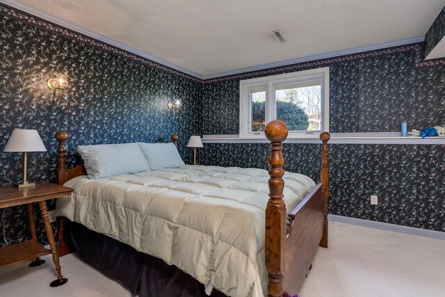 2324 Fair St, Mankato, MN 56001 - carpeted bedroom with visible vents, ornamental molding, and wallpapered walls