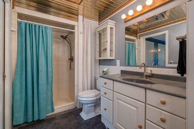 2324 Fair St, Mankato, MN 56001 - bathroom with vanity, a shower with shower curtain, and toilet
