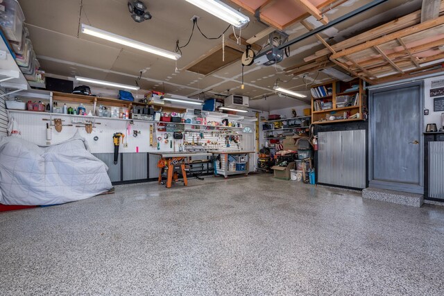 2324 Fair St, Mankato, MN 56001 - garage featuring a workshop area and a garage door opener
