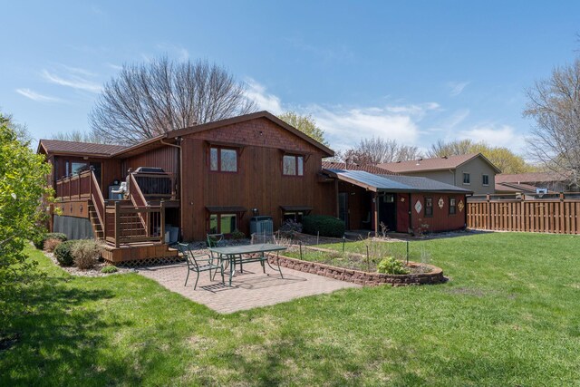2324 Fair St, Mankato, MN 56001 - rear view of property featuring fence, stairs, a wooden deck, a patio area, and a yard