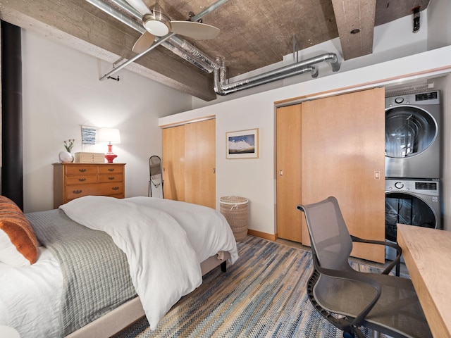 901 3rd St Unit 510, Minneapolis, MN 55401 - bedroom with stacked washing maching and dryer, ceiling fan, and two closets