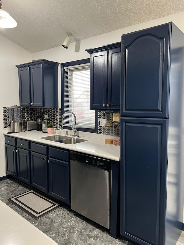 kitchen with a sink, light countertops, backsplash, and dishwasher
