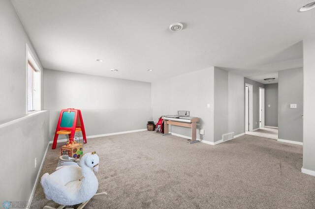 game room with carpet and baseboards