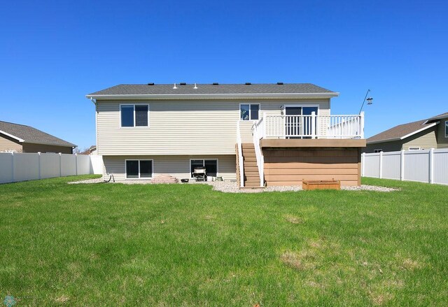 rear view of house featuring a deck