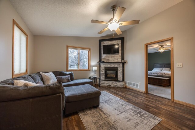 434 Fridell Cres, Red Wing, MN 55066 - living area with dark wood-style floors, a stone fireplace, a ceiling fan, and baseboards