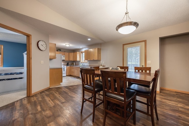 434 Fridell Cres, Red Wing, MN 55066 - dining room with dark wood-style flooring, lofted ceiling, and baseboards
