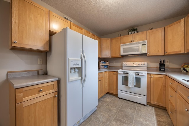 434 Fridell Cres, Red Wing, MN 55066 - kitchen with white appliances, light countertops, a textured ceiling, and light tile patterned floors