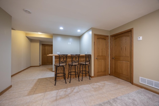 434 Fridell Cres, Red Wing, MN 55066 - indoor bar with baseboards, recessed lighting, and light tile patterned floors