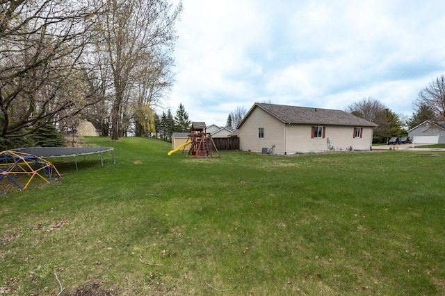 434 Fridell Cres, Red Wing, MN 55066 - view of green lawn with a trampoline and a playground