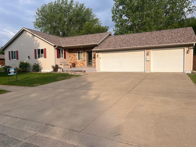 434 Fridell Cres, Red Wing, MN 55066 - ranch-style house featuring driveway, a garage, a front yard, and a shingled roof