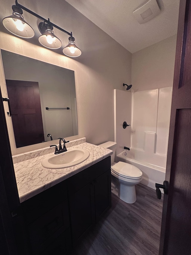 LOT11 Open Meadows Ct SE, Bemidji, MN 56601 - full bath featuring visible vents, bathtub / shower combination, wood finished floors, vanity, and toilet