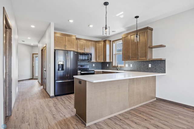 kitchen featuring stainless steel appliances, a peninsula, light wood-type flooring, open shelves, and recessed lighting