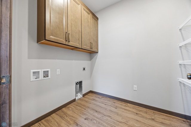 laundry area with hookup for an electric dryer, hookup for a washing machine, cabinet space, light wood-style floors, and baseboards