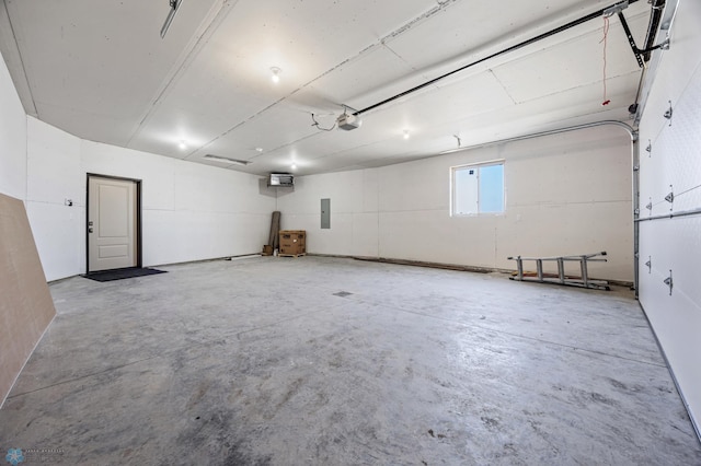 garage featuring a garage door opener and electric panel