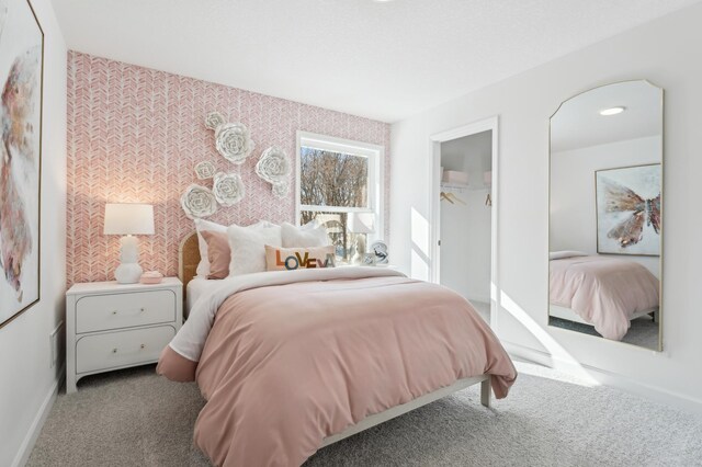 2704 Aspen Dr, Shakopee, MN 55379 - carpeted bedroom featuring baseboards, a closet, and a walk in closet
