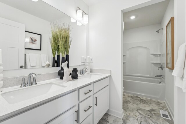 2704 Aspen Dr, Shakopee, MN 55379 - bathroom featuring toilet, double vanity, bathtub / shower combination, recessed lighting, and baseboards