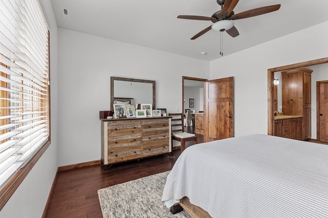 bedroom with baseboards, multiple windows, a ceiling fan, and dark wood finished floors