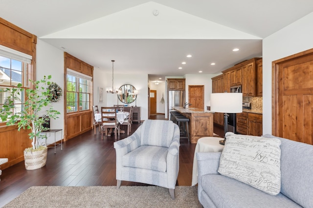 7466 Fairway Ln, Breezy Point, MN 56472 - living room featuring lofted ceiling, a chandelier, recessed lighting, and dark wood-type flooring