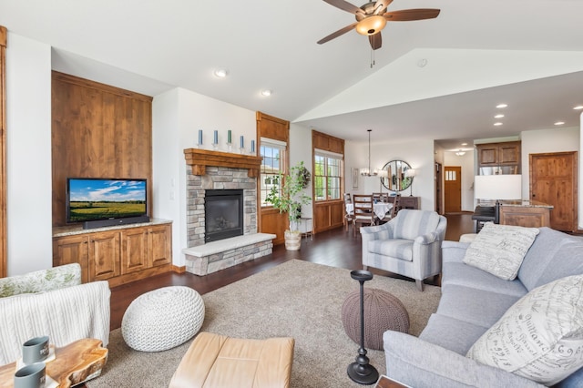 7466 Fairway Ln, Breezy Point, MN 56472 - living area featuring dark wood finished floors, vaulted ceiling, a ceiling fan, a stone fireplace, and recessed lighting