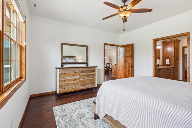 7466 Fairway Ln, Breezy Point, MN 56472 - bedroom with dark wood-style flooring, multiple windows, ensuite bath, and ceiling fan