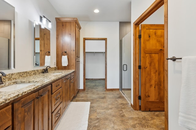 7466 Fairway Ln, Breezy Point, MN 56472 - bathroom with double vanity, a stall shower, stone finish floors, and recessed lighting