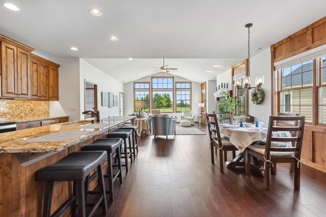 7466 Fairway Ln, Breezy Point, MN 56472 - dining space with ceiling fan, dark wood finished floors, vaulted ceiling, and recessed lighting