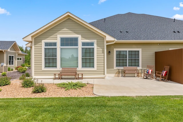 7466 Fairway Ln, Breezy Point, MN 56472 - back of house featuring a patio area, a yard, and a shingled roof